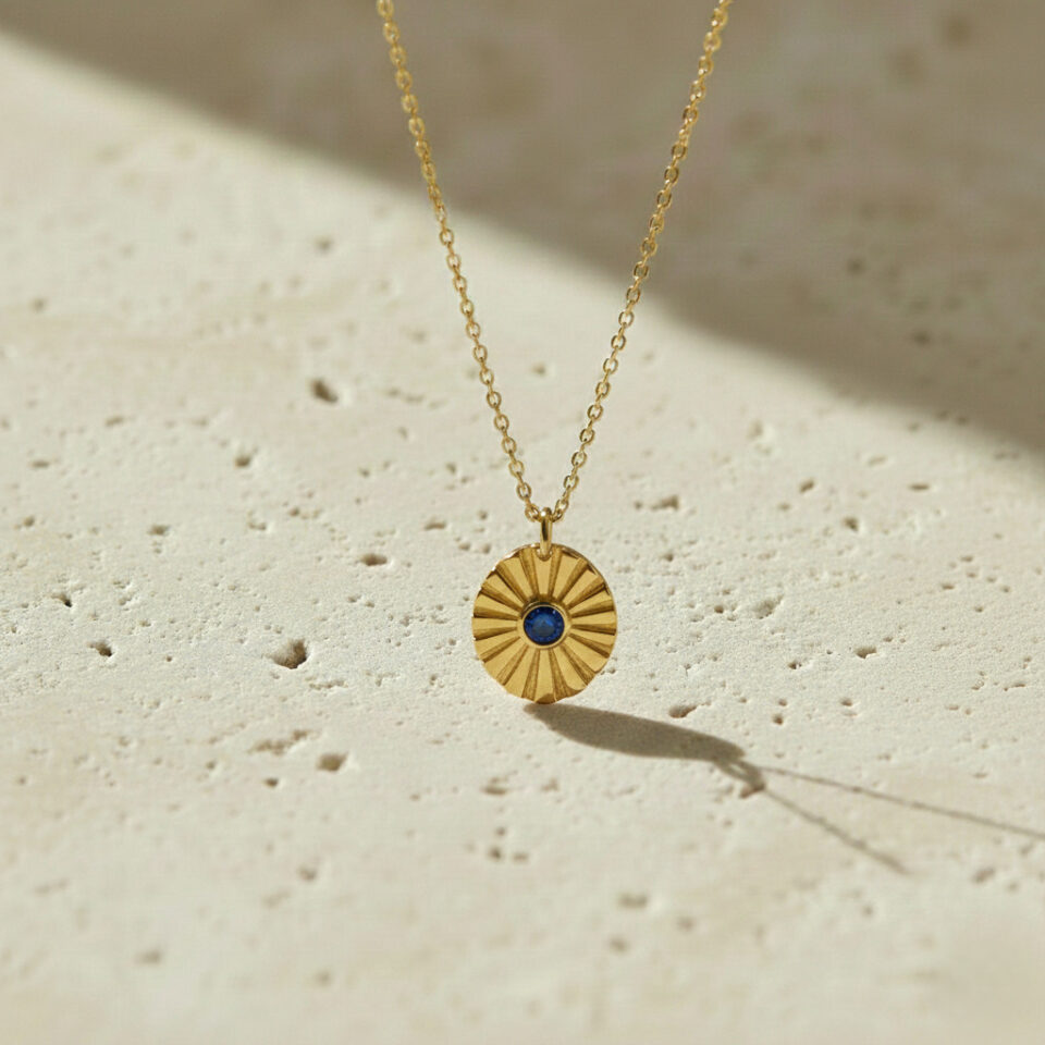 Gold kyanite pendant necklace with oval textured design, handcrafted gemstone jewelry by Jaipur manufacturer