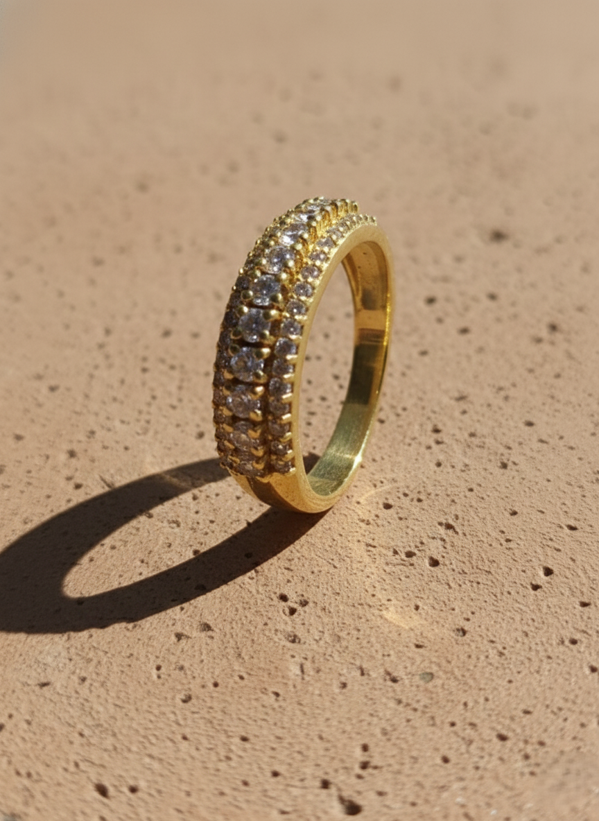 Gold CZ band ring with triple-row sparkling cubic zirconia stones, elegant women’s jewelry for daily wear and gifting. High-quality finish, shine and luxury design.