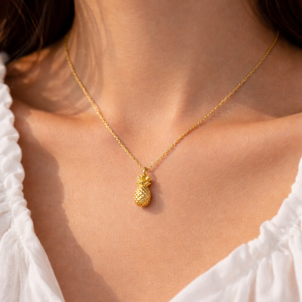 Pineapple charm gold necklace close up