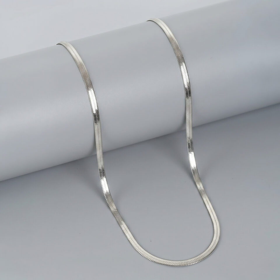 Gold plated snake chain necklace with sleek reflective shine.