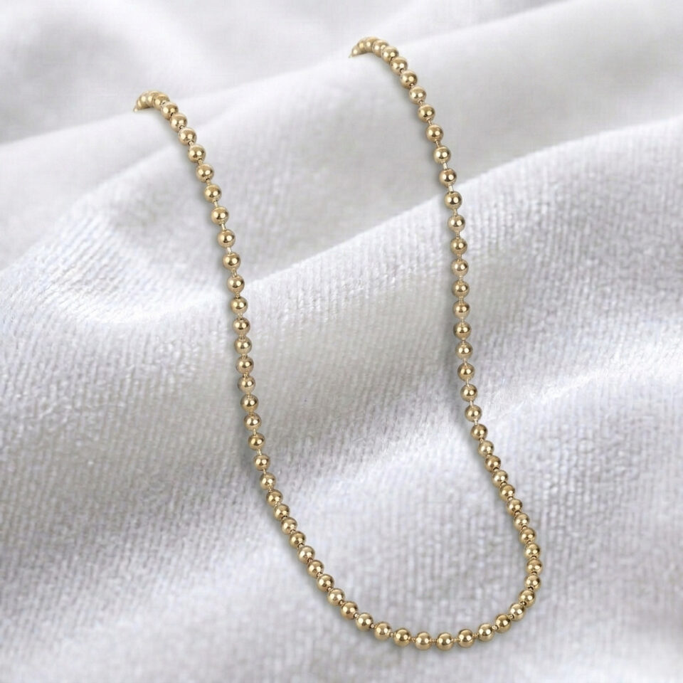gold plated sterling silver beaded chain necklace with polished beads.
